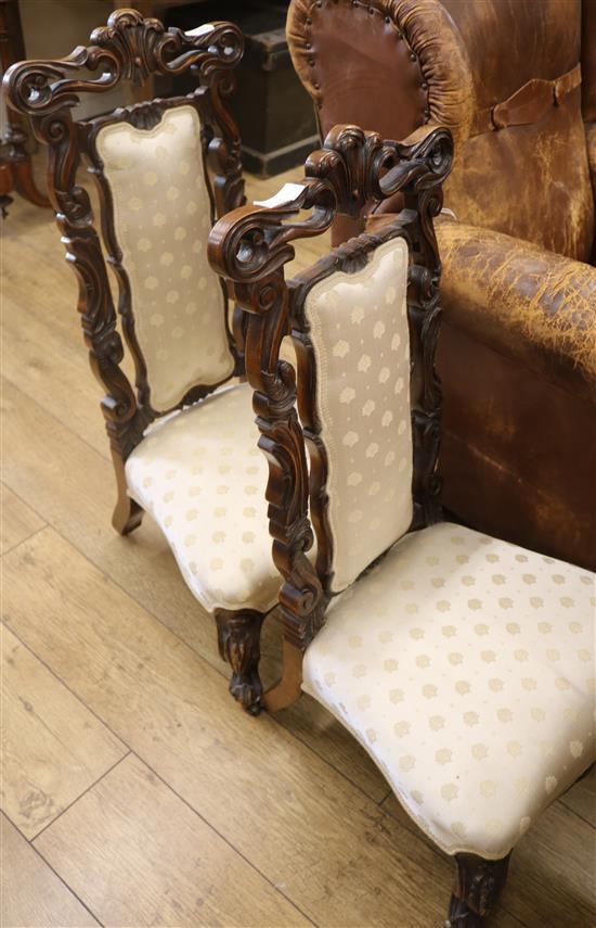A pair of Victorian walnut nursing chairs